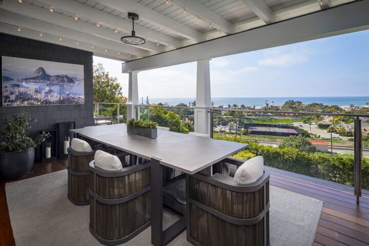 With fire features and lounge appeal, the veranda serves as the home’s centerpiece