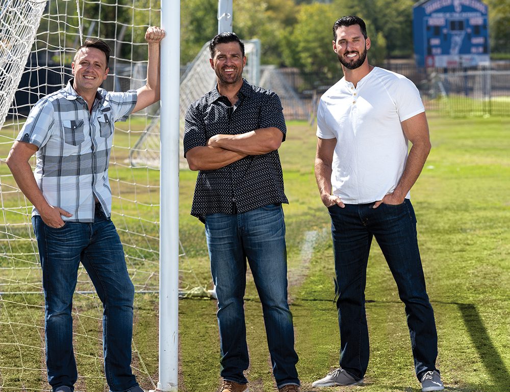 1 More Win’s founders Jesse Lozano, Jason Young, and John Masnica on the field at Orange Glen High School