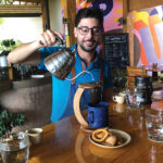 Barista Luis Carlos Herrera demonstrates the traditional Costa Rican brewing method using a chorreador