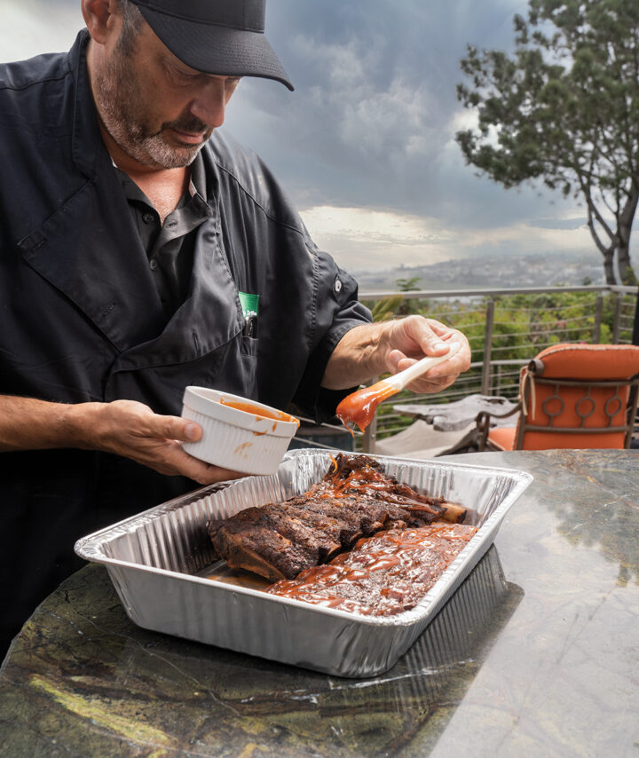 Layering ribs with BBQ sauce outside