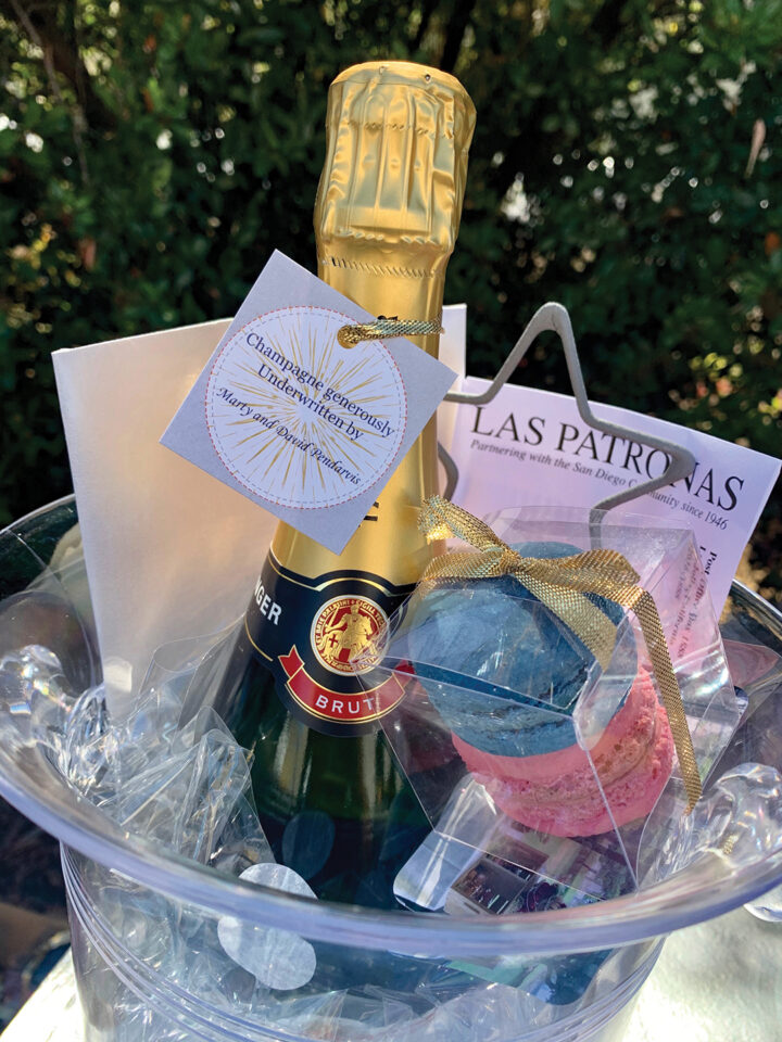 Champagne and treats in a clear bucket