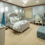 Daughter Venice’s room is decorated in cool tones of silver and pale turquoise with sparkly pillows and a mirrored vanity