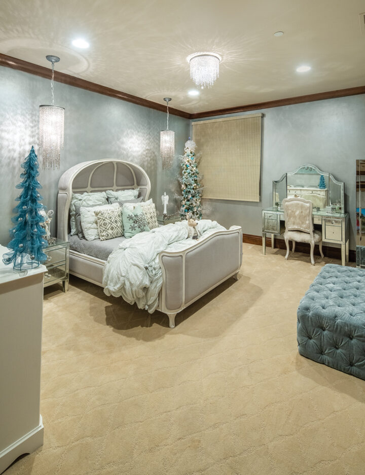 Daughter Venice’s room is decorated in cool tones of silver and pale turquoise with sparkly pillows and a mirrored vanity