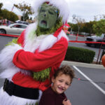 The Grinch and a young fan