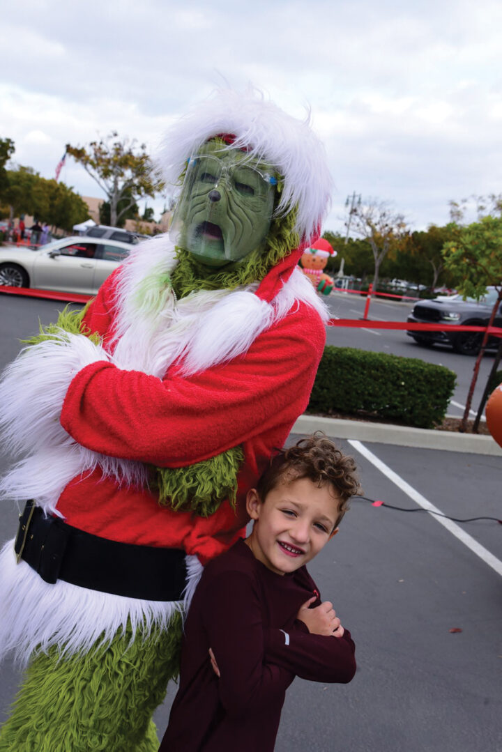 The Grinch and a young fan