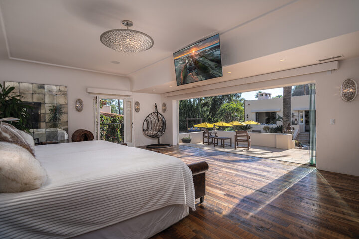 The sumptuous master suite opens onto the expansive courtyard pool.