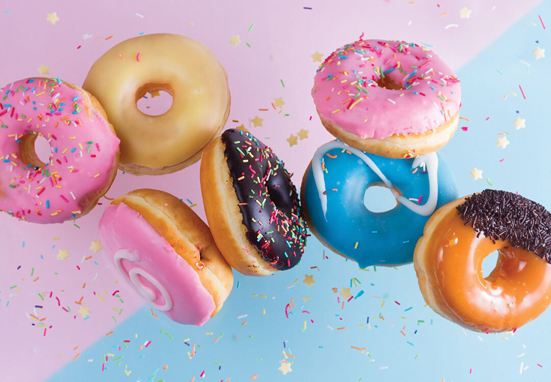 flying doughnuts on blue and pink background