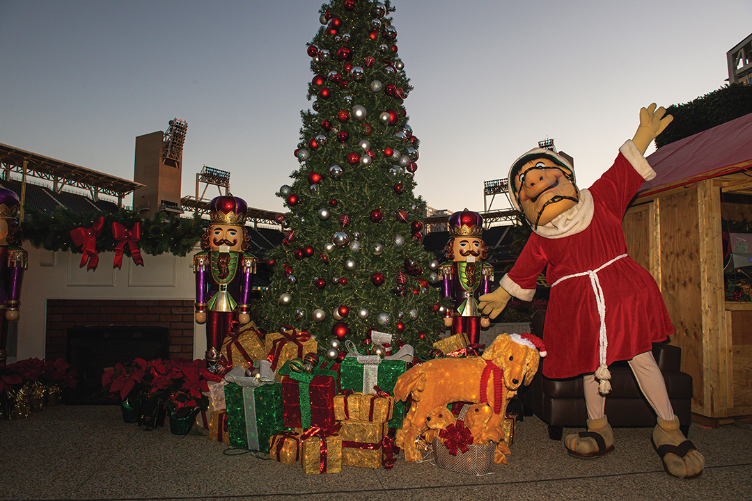 December 3, 2020, San Diego, CA: Friar poses near a Christmas tree at the Holiday Market at Petco Park in San Diego, California on Friday, December 3rd, 2020.(Photo by Matt Thomas/San Diego Padres)