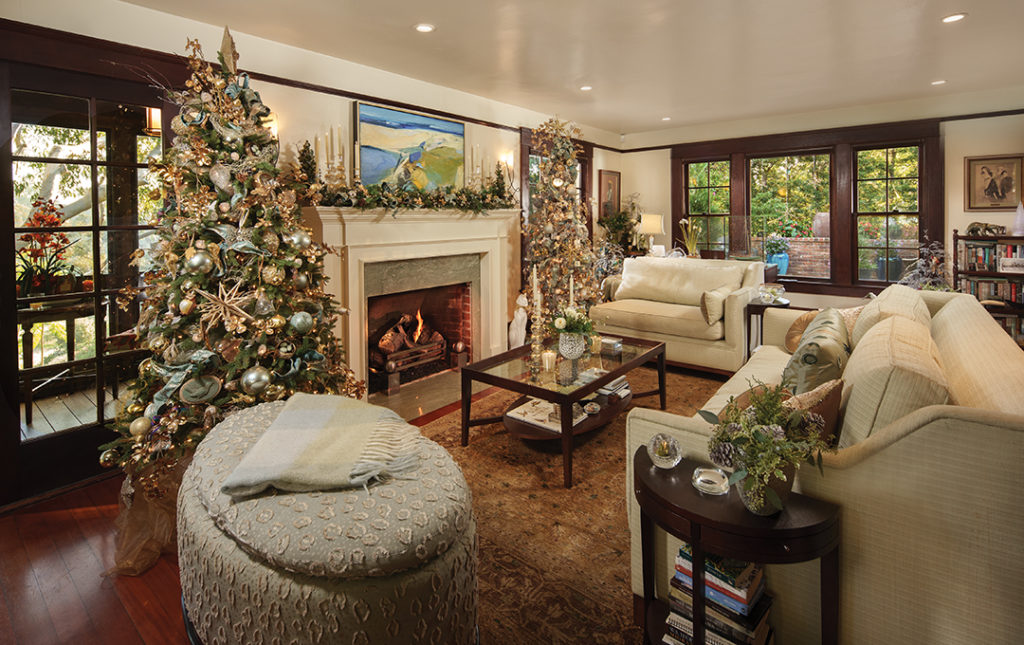 Two trees flanking the fireplace are decorated in a woodland theme with ornaments the Moxhams have collected over 45 years