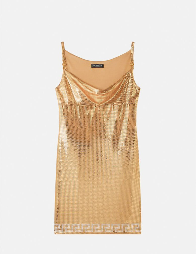 This glittering mini dress from Versace, just opened at Fashion Valley, is covered with mirror-effect golden crystals (with the look of the brand’s iconic metal mesh) and is further adorned with Medusa hardware on the slim shoulder straps