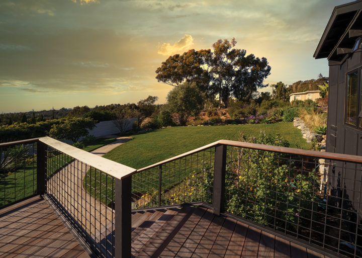 The terrace leads to a grassy backyard with stands of eucalyptus and fruit trees, most original to the property