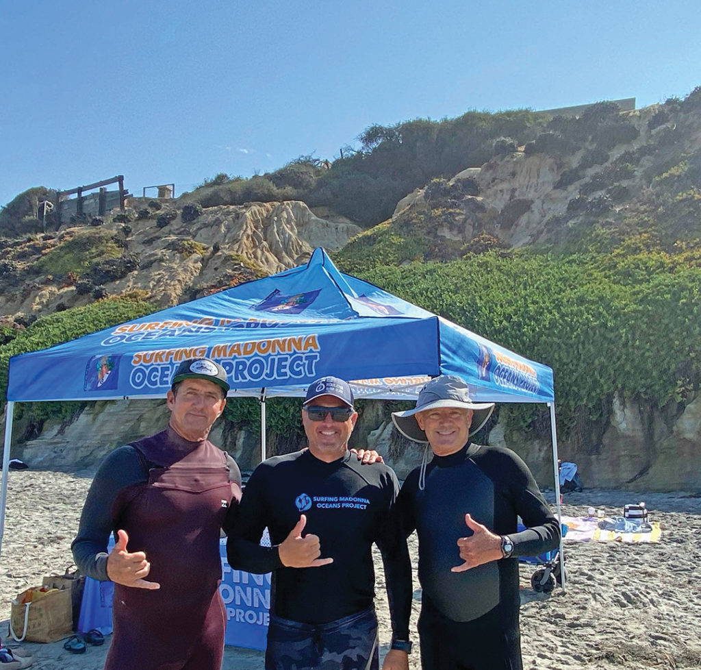 Jon Peterson, Eric Franklin, and Mike Redman, president of the Surfing Madonna Oceans Project