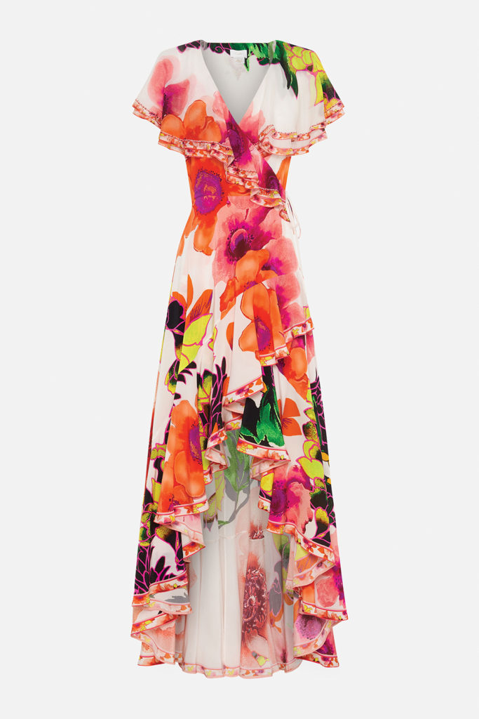 A flowing wrap dress with frilly sleeves from Camilla at South Coast Plaza is as “Pretty as a Poppy,” the name of this vibrant silk print abloom with botanicals in magenta, orange, and lime. 949.468.2904, camilla.com