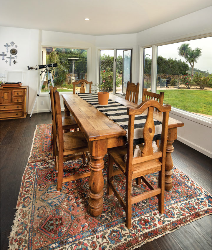 The dining room and kitchen offer sweeping views of the North County coastline