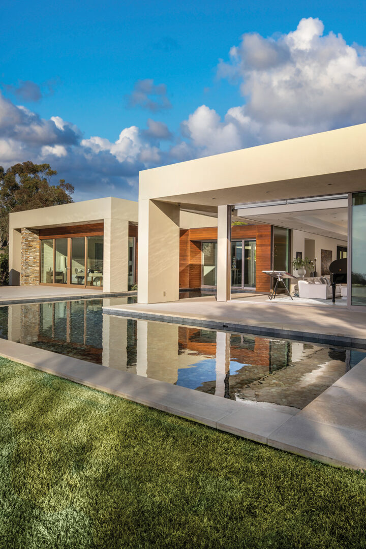 Houston architect Robert Griffin says he designed the main house to “complement and blend into the existing topography, creating courtyards and terraces that weave interior living spaces with exterior spaces”