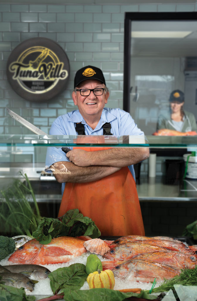 Tommy “The Fishmonger” Gomes, behind the counter at his TunaVille Market and Grocery in Point Loma