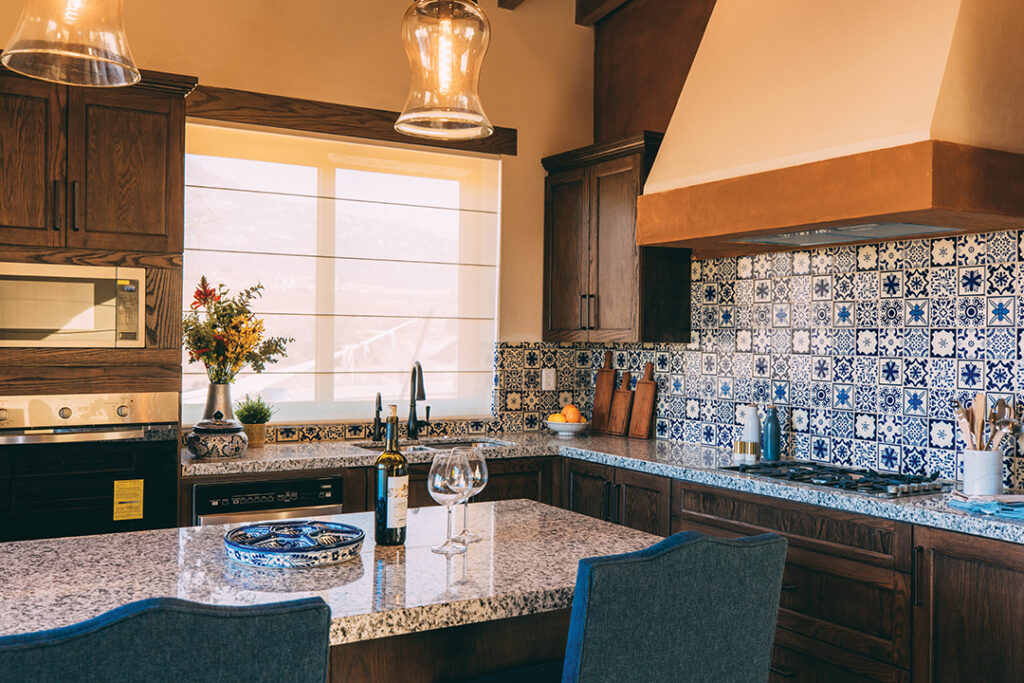 A fully equipped kitchen features fine Mexican craftsmanship and state-of-the-art appliances