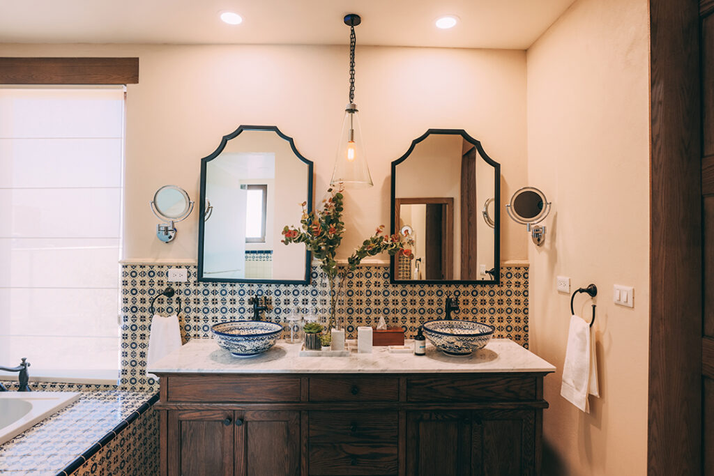 Bathrooms feature Mexican mosaic tile on tubs and backsplashes