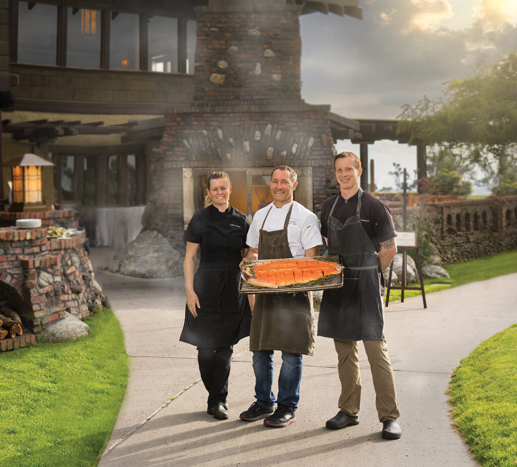 Hot-smoked ocean trout was on the menu at “Playing with Fire,” the seasonal grilling series at The Grill at Torrey Pines. Executive Chef Kelli Crosson and Chef de Cuisine Ryan Dzierzawski (right) partnered with featured Chef Tim Kolanko (center) of Urban Kitchen Group