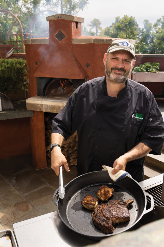 Chef/Owner Jeffrey Strauss of Pamplemousse Grille fires up the pizza oven and grill on his ocean view terrace in Solana Beach