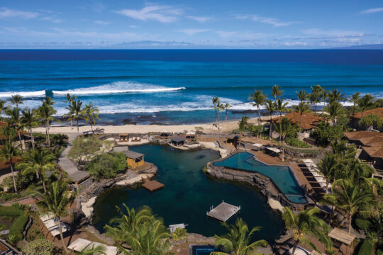 The swimmable King’s Pond is home to Four Seasons Hualalai’s famous resident spotted eagle ray, Kainalu