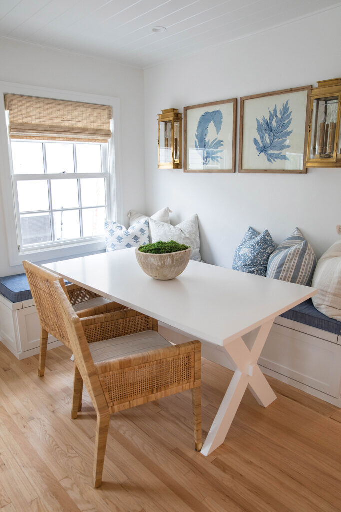 The dining table off the living room is custom designed by Ybarra Woodworks with chairs from Serena & Lily, cushions from Irichka, and throw pillows from Schumacher and Kerry Joyce Textiles