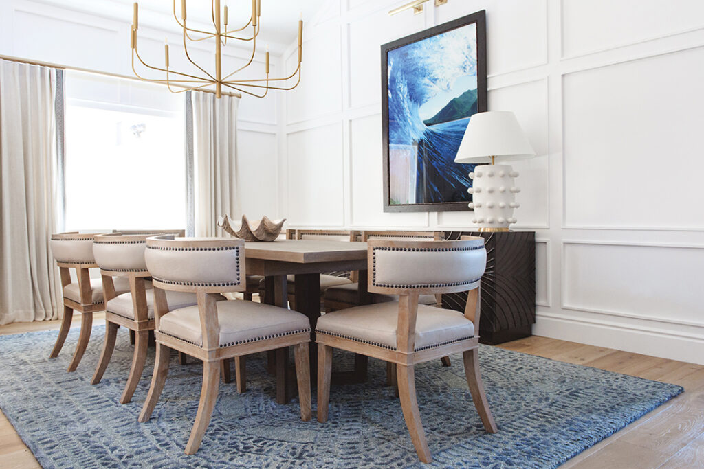 The elegant dining room features Brownstone Furniture and art by Leftbank