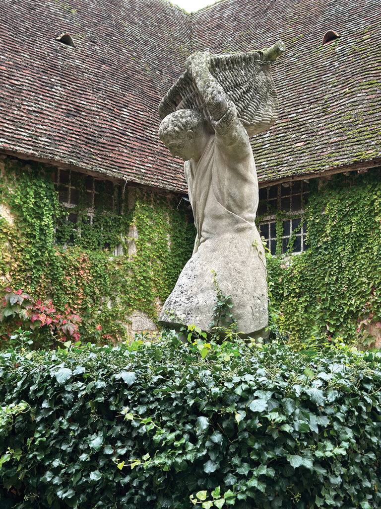 Le porteur de benaton, by sculptor Henri Bouchard, stands on the grounds of Château du Clos de Vougeot, once home to monk-tended vineyards in honor of the abbot of Citeaux and today a 12th-century center for social activities, to promote Burgundy wines throughout the world