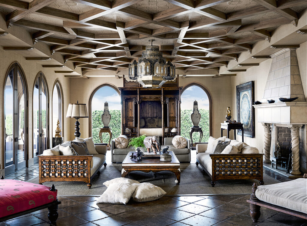 Cher, who wrote the book’s foreword, said Bullard understood her “passion for the exotic.” The main living room in her hilltop Malibu home is anchored by an 18th-century opium bed. The carved walnut sofas were custom designed in a Moorish style while the coffee table was originally a Chinese bed. A mandala that Cher brought back from Tibet hangs on the wall