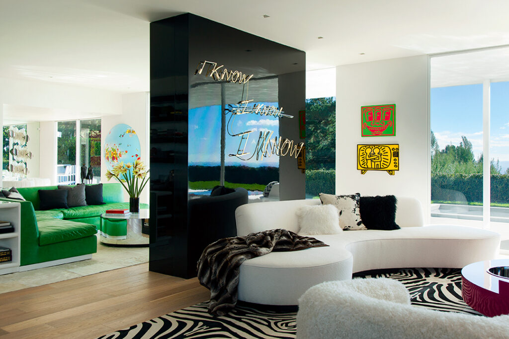 The home that Elton John shares with partner, David Furnish, is the backdrop for their personal art collection mixed with Italian, French, and American furniture from the 1960s and ’70s. A Tracey Emin sculpture, mounted on a lacquered wall, is balanced by a pair of Keith Haring oil paintings