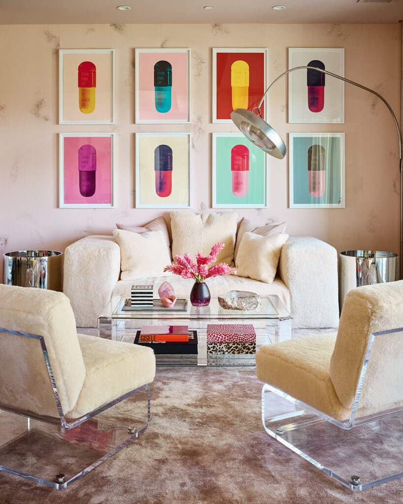 The sitting area in Kylie Jenner’s bedroom also has pops of pink and artwork by Damien Hirst