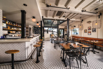 Valentina’s cozy, black-and-white environs include subway tiles along the adjoining bar and wood accents throughtout, as well as sheet-white banquettes al fresco