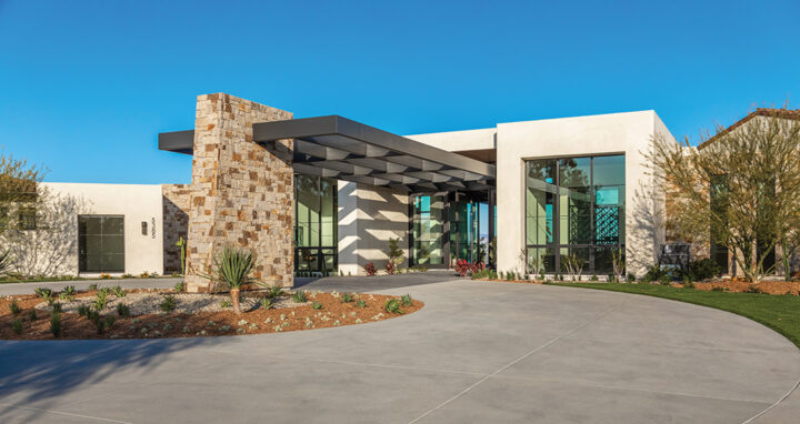 The dramatic cantilevered steel beam entry includes a porte-cochere