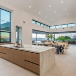 Expansive kitchens (three in all) feature Miele appliances, wood cabinets imported from Belgium, and countertops and flooring from the Tile Collective in Solana Beach