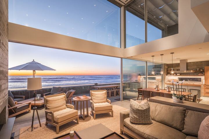 Watch the sun rise and set from the great room which opens onto the oceanfront deck and outdoor entertainment area with a fireplace, lounge chairs, dining table, and barbecue. There’s even a foot-washing station