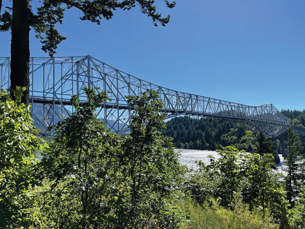 The steel truss cantilever bridge named "The Bridge of the Gods" spans the Columbia River between Cascade Locks, Oregon, and Washington state near North Bonneville