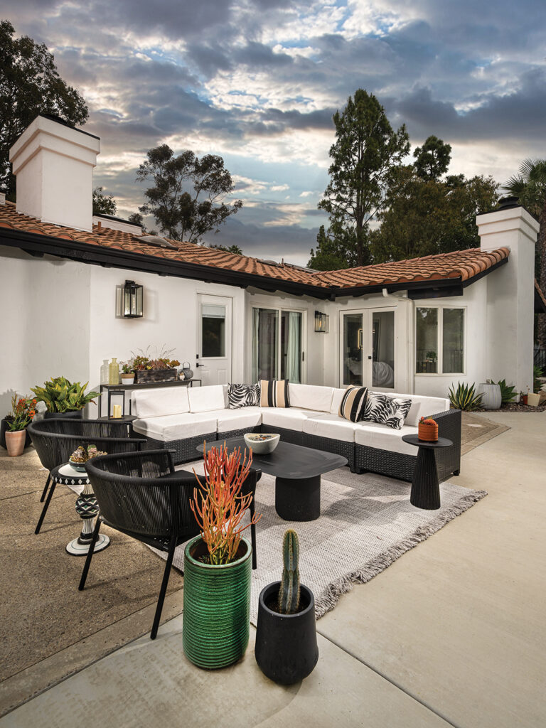 In the outdoor living room, seating is from West Elm and Rove Concepts, the coffee table is from Article, and side tables are from Rove Concepts and Grandin Road