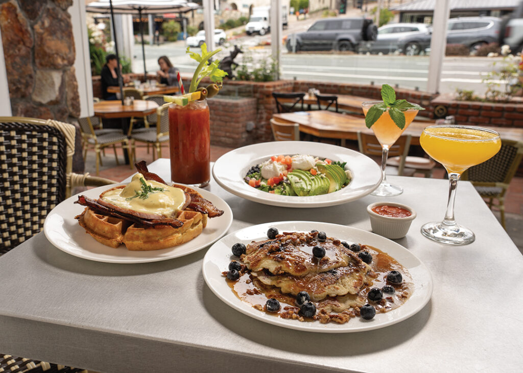 A classic American diner serving breakfast and lunch in La Jolla since 1960, Harry’s Coffee Shop opened a sister location in the heart of Del Mar Village last year. The menu features standouts including (clockwise L-R) The B.W. Benny: waffle with bacon inside and out, grilled ham, poached eggs, topped with hollandaise sauce; Bloody Mary; San Diego Super Bowl: poached eggs, black beans, kale, quinoa, feta, avocado with greens tossed with lemon vinaigrette; Morning Martini: Tito’s Vodka, St-Germain, grapefruit juice; Tangerine Mimosa; Oatmeal Blueberry Pancakes, served with blueberries, pecans, and topped with whipped cream.