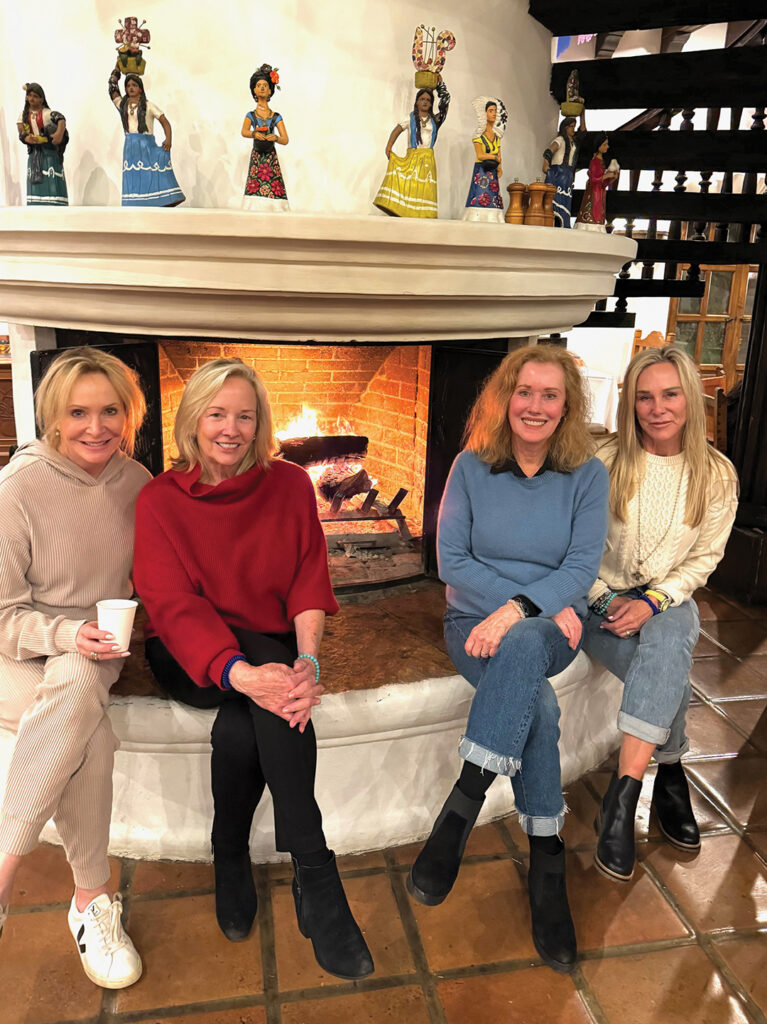 Friends relaxed by the fireplace in the lovely dining hall. From left to right: Sandra Maas, Andrea Naversen, Suzy Westphal, and Lisa Fisher