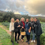 Guests plucked — and tasted — produce from Rancho La Puerta’s bountiful garden prior to the interactive cooking class with Guest Chef Janina Garay (third from right) and Executive Chef Reyna Venegas (far right)