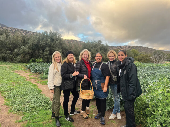 Guests plucked — and tasted — produce from Rancho La Puerta’s bountiful garden prior to the interactive cooking class with Guest Chef Janina Garay (third from right) and Executive Chef Reyna Venegas (far right)