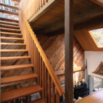 The exposed stairway provides views and graphic appeal