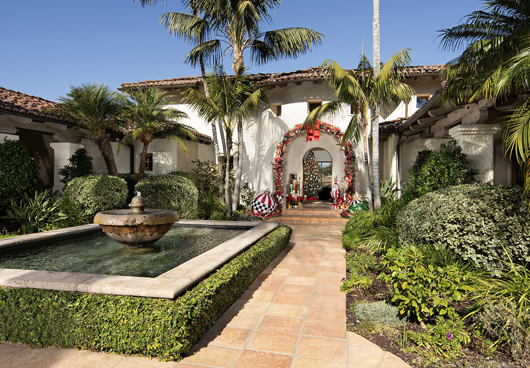 At the Rancho Santa Fe home of Ted Hoehn and partner Matt Clermont, the festive arch over the front door and decorations were designed with the help of Kimberly Buffington of Flowerchild