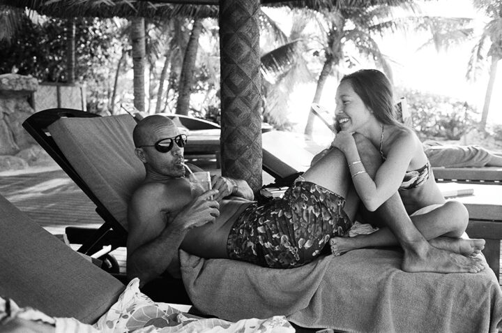 Kelly and his partner, Kalani Miller, share a moment on Tavarua in Fiji