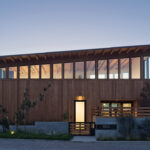 Like a lantern, the Cornish residence emits a warm glow come evening