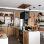 The kitchen was designed with the help of a chef friend to optimize its ergonomics. Custom-built with concrete and raw wood, it blends professional-grade equipment with a warm aesthetic, including a butcher block sourced from an old Bayonne butcher shop