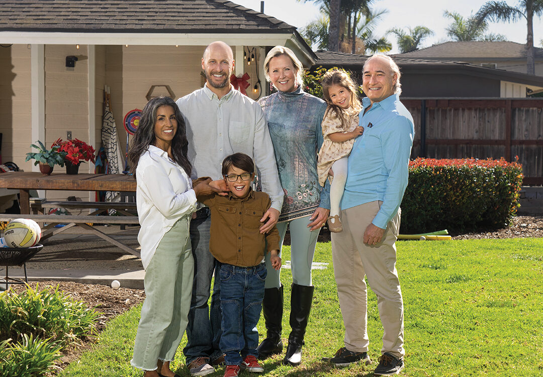 Darlene and Nick Abrams (left) and their children, Owen and Penny, with Charity Ball chair Micki Olin and husband Reid Abrams outside