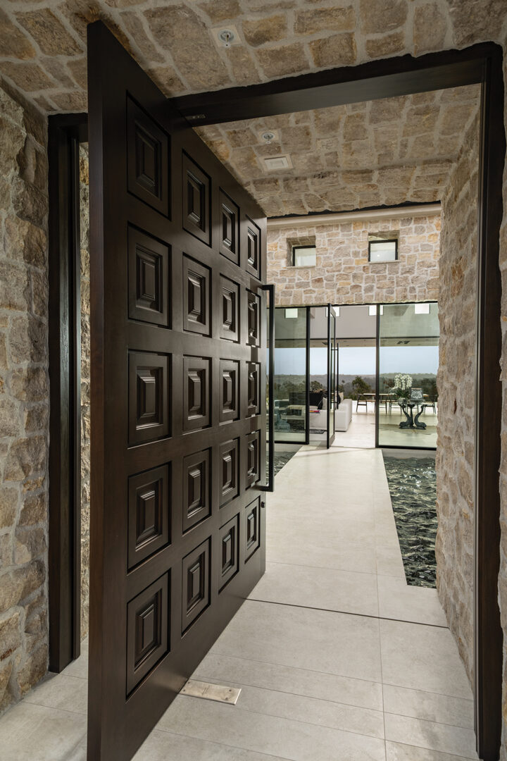 An 1800s-era Italian door that Sarkis saw on her world travels inspired the home’s entry door, one of her favorite features, crafted by Jensen Doors