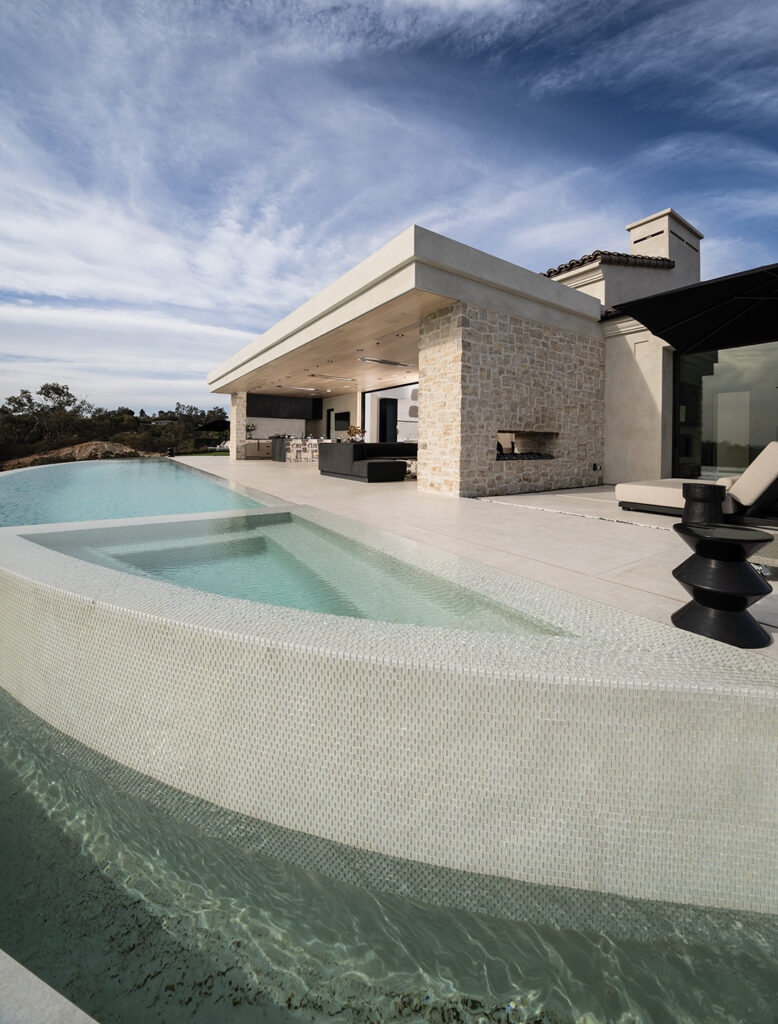 The home’s patio overlooks an infinity-edge pool with dazzling views from the Ranch to the coast