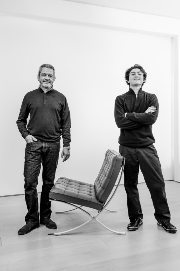 Dr. Hugo Barrera and his son, Paolo Barrera with the Barcelona chair